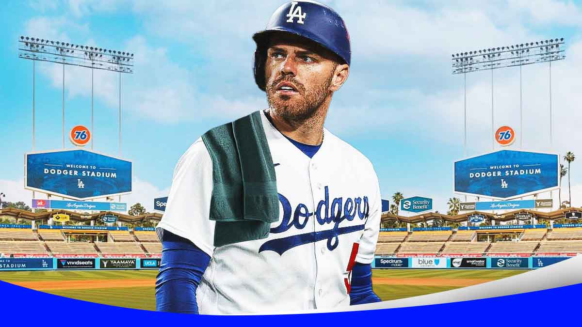 Freddie Freeman with a bathroom towel over his shoulder in front of Dodgers Stadium.