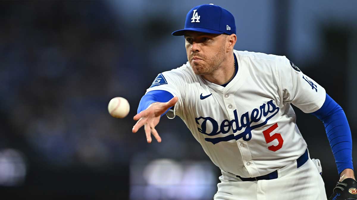 Los Angeles Dodgers first baseman Freddie Freeman (5) tosses to first for an out during the 3rd inning against the Detroit Tigers at Dodger Stadium.