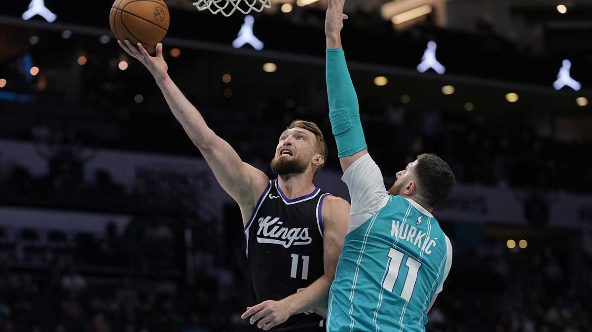 The Kings of the Kings of Sacramento Domantas Sabonis (11) pulls the ball in front of the center of Charlotte Hornets Jusuf Nurkic (11) during the first quarter at the Spectrum Center.