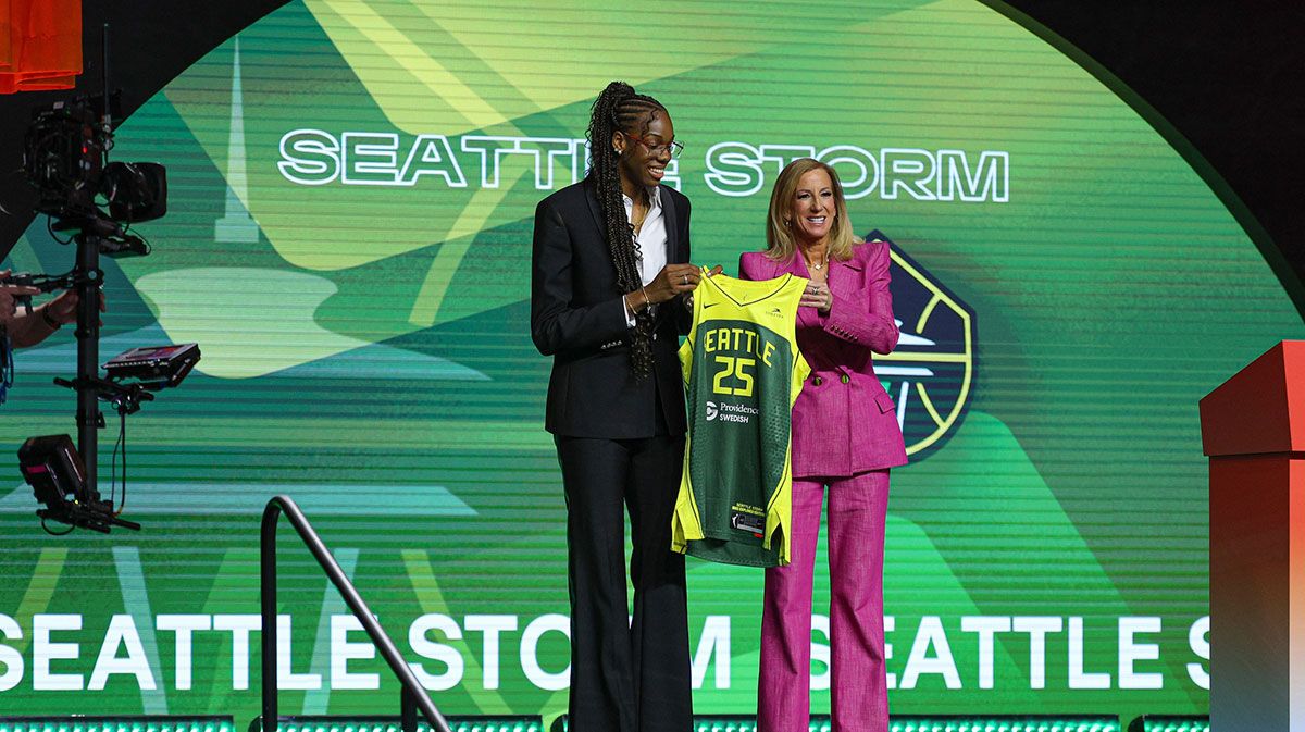 Dominique Malonga poses with WNBA commissioner Cathy Engelbert after being selected with the number two overall pick to the Seattle Storm in the 2025 WNBA Draft.