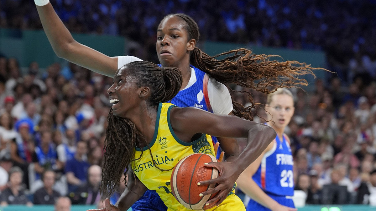 Australia forward Ezi Magbegor (13) controls the ball against France centre Dominique Malonga (14) in the second half in a women’s group B game during the Paris 2024 Olympic Summer Games at Stade Pierre-Mauroy.