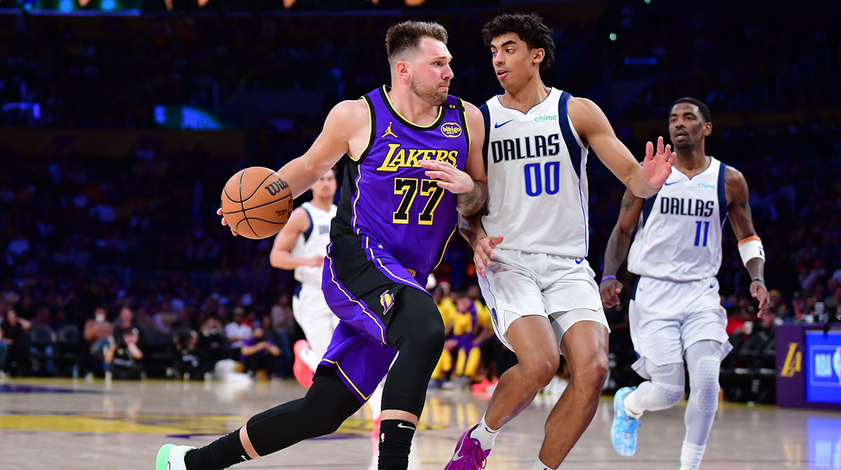 Los Angeles Lakers guard Luka Doncic (77) dribbles the ball Dallas Mavericks guard Max Christie (00) during the second half at Crypto.com Arena.