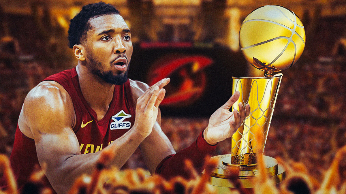 Donovan Mitchell with the Larry O'Brien trophy featuring an explosive Cavs-themed BG.