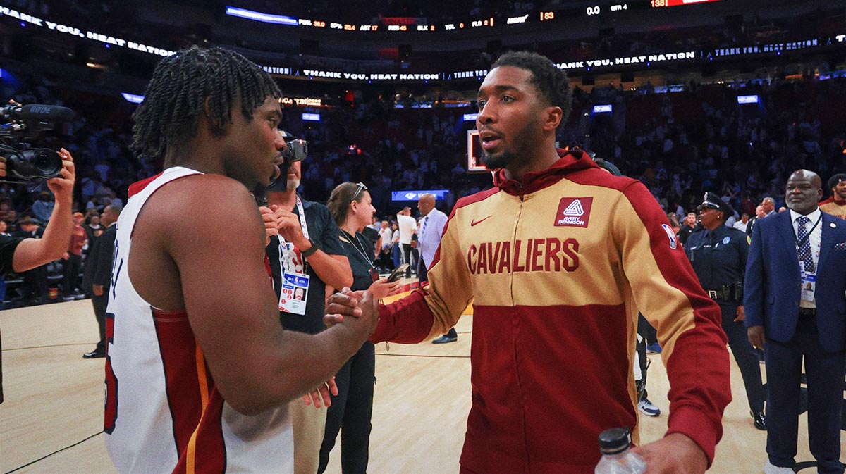 Cleveland Cavaliers guard Donovan Mitchell (45) shakes hands with Miami Heat guard Davion Mitchell (45) after game four for the first round of the 2025 NBA Playoffs at Kaseya Center.
