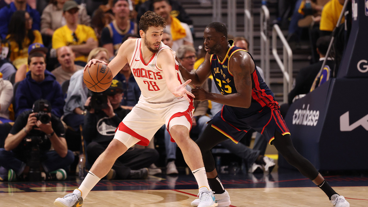 Houston Rockets center Alperen Sengun (28) controls the ball against Golden State Warriors forward Draymond Green (23) during the second quarter of game four of the 2025 NBA Playoffs first round at Chase Center.