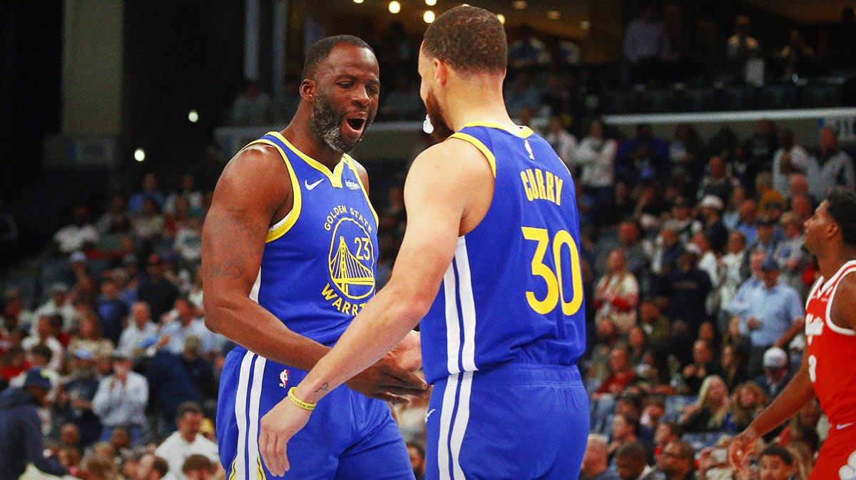 Golden State Warriors forward Draymond Green (23) reacts with Golden State Warriors guard Stephen Curry (30) prior to the game against the Memphis Grizzlies at FedExForum.