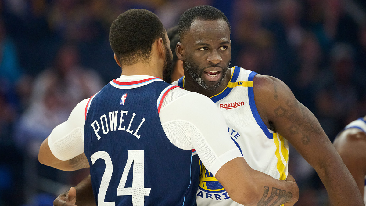 Golden State Warriors forward Draymond Green (23) hugs LA Clippers guard Norman Powell (24) before the start of the first quarter at Chase Center.