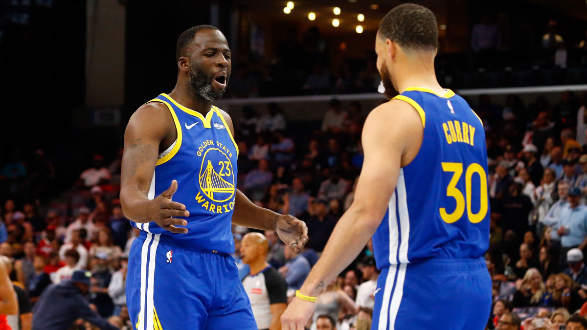 Golden State Warriors forward Draymond Green (23) reacts with guard Stephen Curry (30) prior to the game against the Memphis Grizzlies at FedExForum.