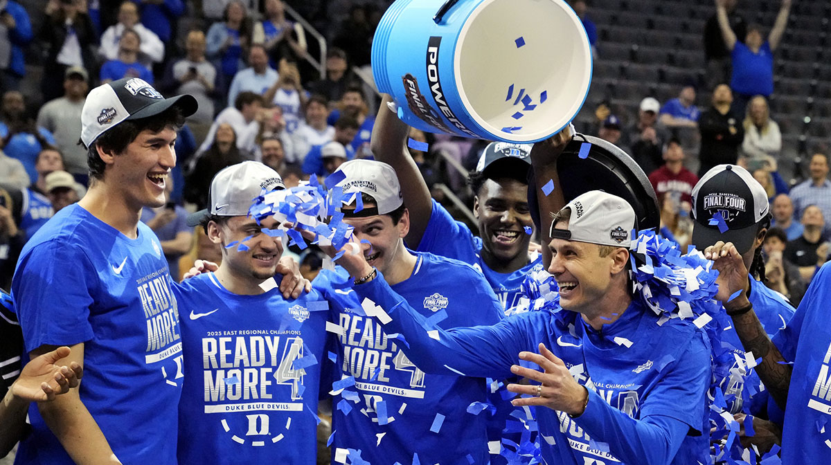 Duke Blue Devils head coach Jon Scheyer celebrates with his team after being the Alabama Crimson Tide in the East Regional final of the 2025 NCAA tournament at Prudential Center.