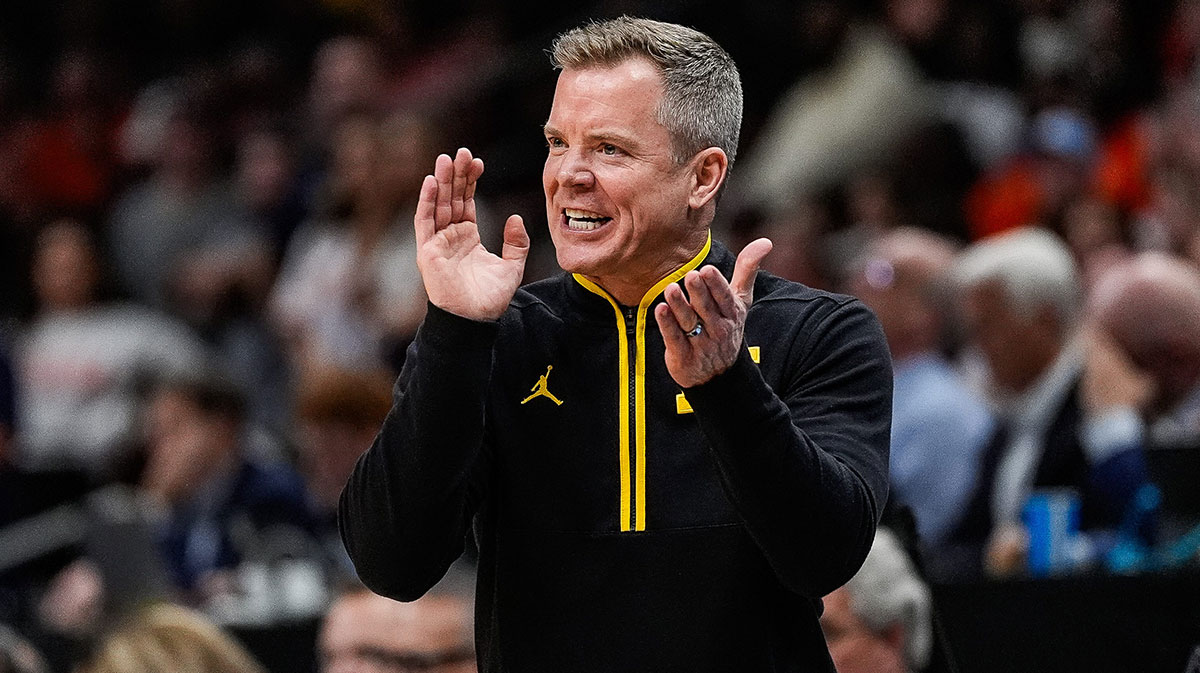 Michigan head coach Dusty May cheers on after a play against Auburn during the second half of the Sweet 16 round of NCAA tournament at State Farm Arena in Atlanta, Ga. on Friday, March 28, 2025.