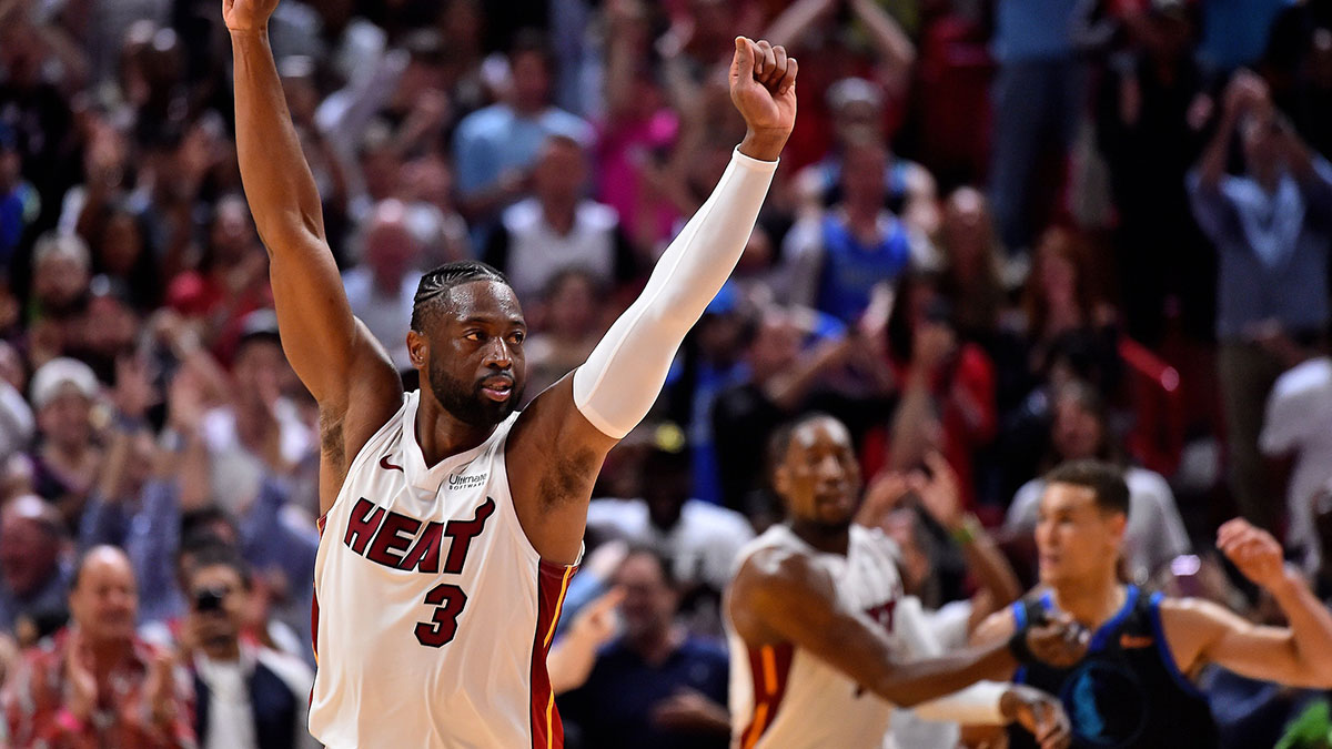 Miami Heat guard Dwyane Wade (3) celebrates after making a basket against the Dallas Mavericks during the second half at American Airlines Arena.