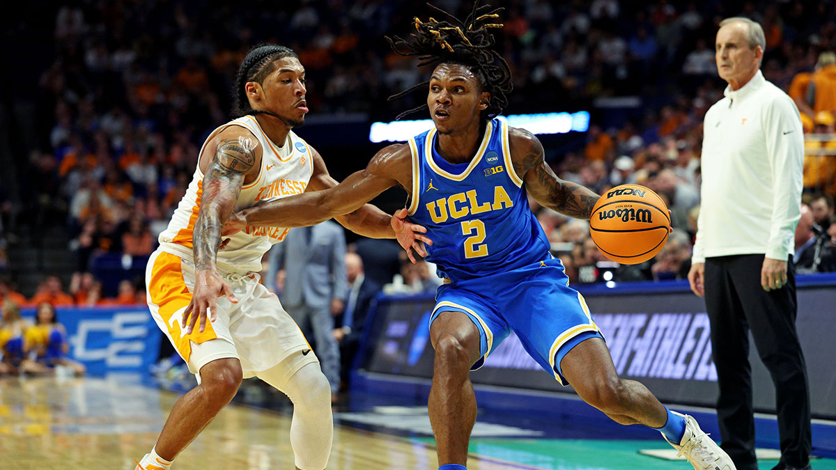 UCLA Bruins guard Dylan Andrews (2) handles the ball against Tennessee Volunteers guard Zakai Zeigler (5) during the first half in the second round of the NCAA Tournament at Rupp Arena.