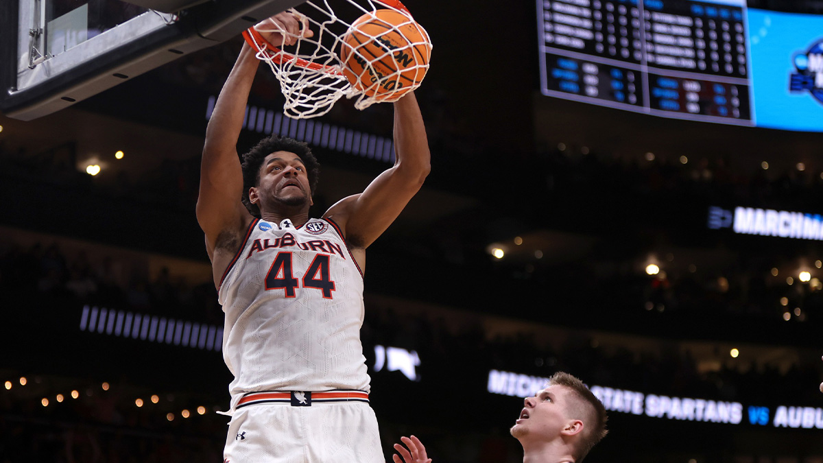 Auburn Tigers center Dylan Cardwell (44) dunks against Michigan State Spartans forward Jaxon Kohler (0) during the first half in the South Regional final of the 2025 NCAA tournament at State Farm Arena.