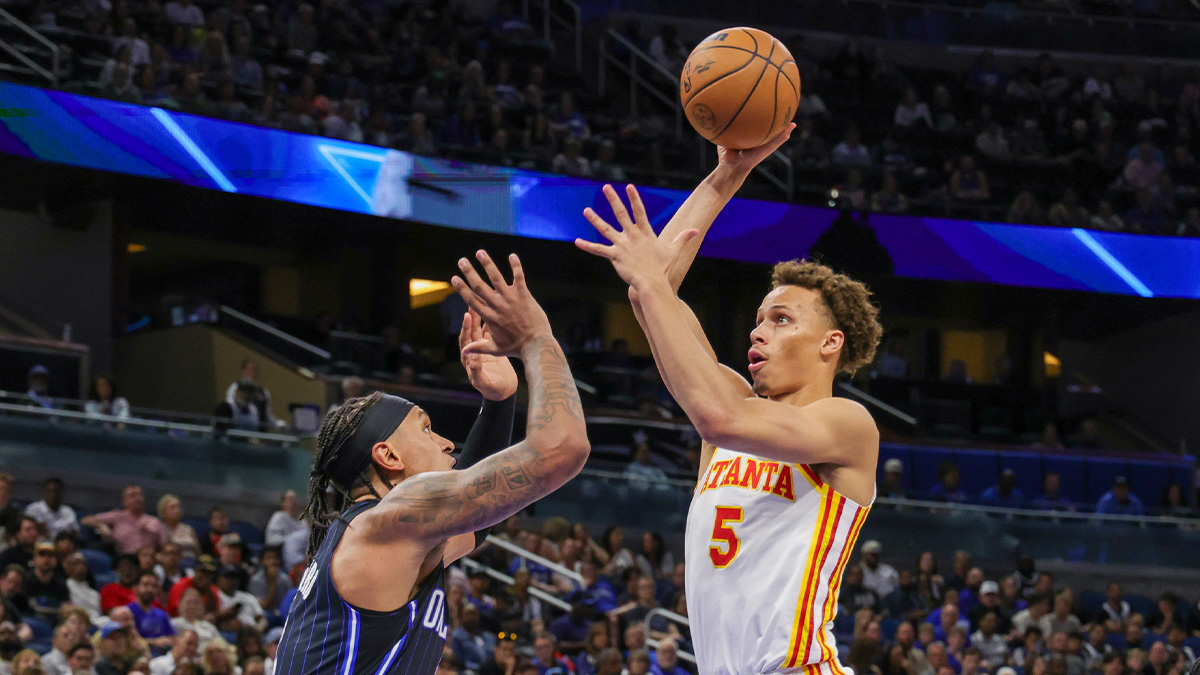 Atlanta Hawks guard Dyson Daniels (5) shoots the ball over Orlando Magic forward Paolo Banchero (5) during the second quarter at Kia Center.
