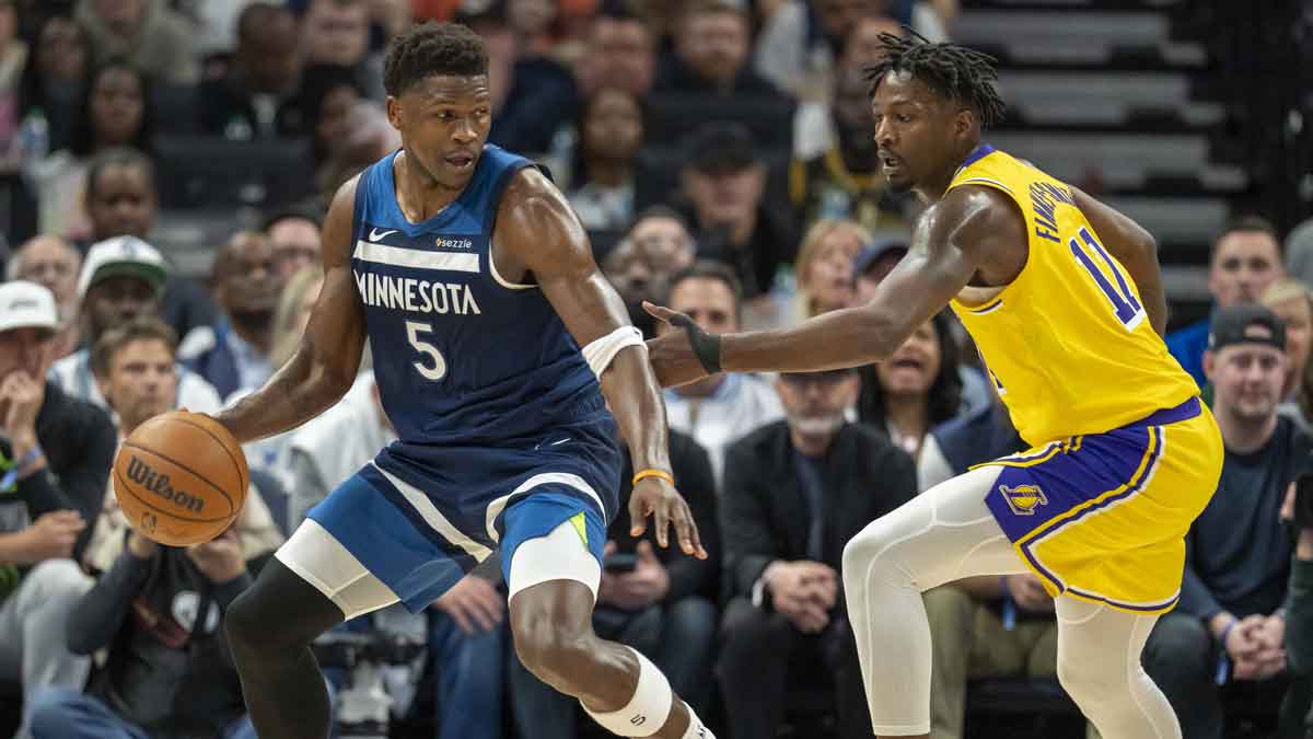 Minnesota Timberwolves guard Anthony Edwards (5) backs towards the basket against the Los Angeles Lakers forward Dorian Finney-Smith (17) in the first half during game three of first round for the 2024 NBA Playoffs at Target Center.