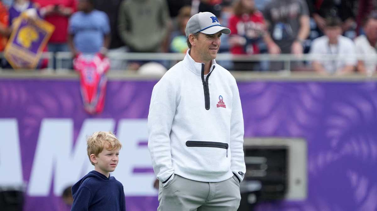 NFC coach Eli Manning with son Charlie Manning during Pro Bowl Games practice at Camping World Stadium.