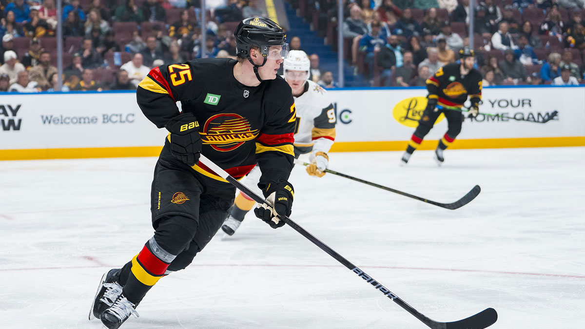 Vancouver Canucks defenseman Elias Pettersson (25) handles the puck against the Vegas Golden Knights in the third period at Rogers Arena.