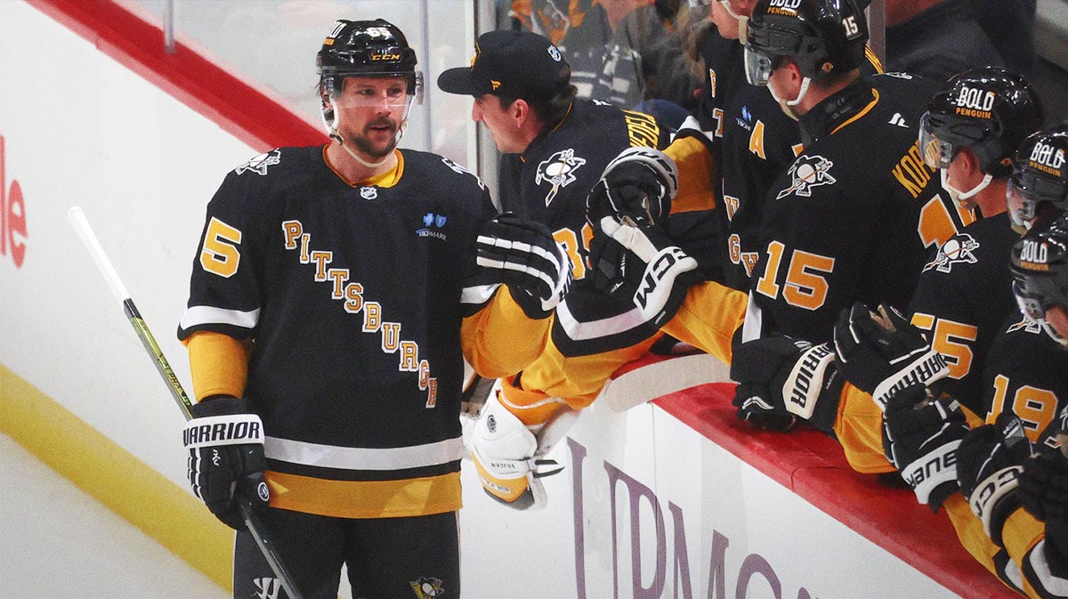 Pittsburgh Penguins defenseman Erik Karlsson (65) celebrates his 200th career NHL goal with the Penguins bench against the Chicago Blackhawks during the second period at PPG Paints Arena.