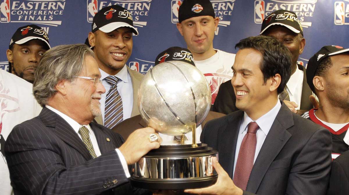 Miami Heat owner Micky Arison (left) presents head coach Erik Spoelstra with the eastern conference championship trophy after game five of the eastern conference finals of the 2011 NBA playoffs against the Chicago Bulls at the United Center.