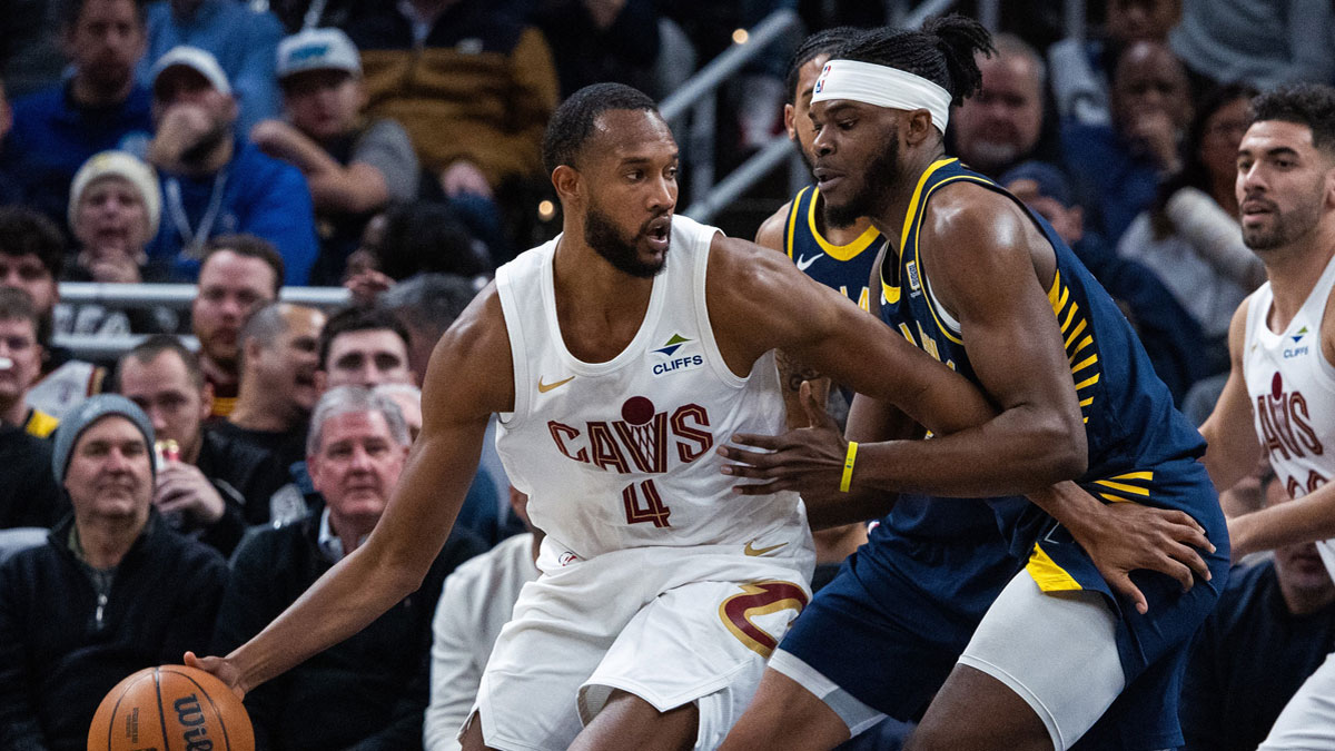 Cleveland Cavaliers forward Evan Mobley (4) dribbles the ball while Indiana Pacers forward Jarace Walker (5) defends in the second half at Gainbridge Fieldhouse.