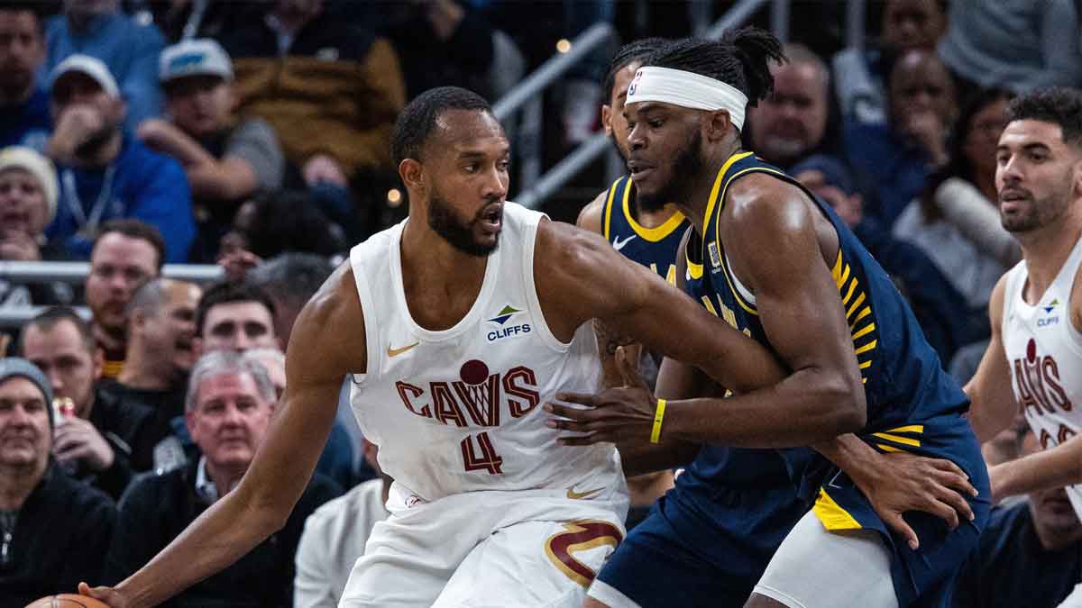 Cleveland Cavaliers forward Evan Mobley (4) dribbles the ball while Indiana Pacers forward Jarace Walker (5) defends in the second half at Gainbridge Fieldhouse.