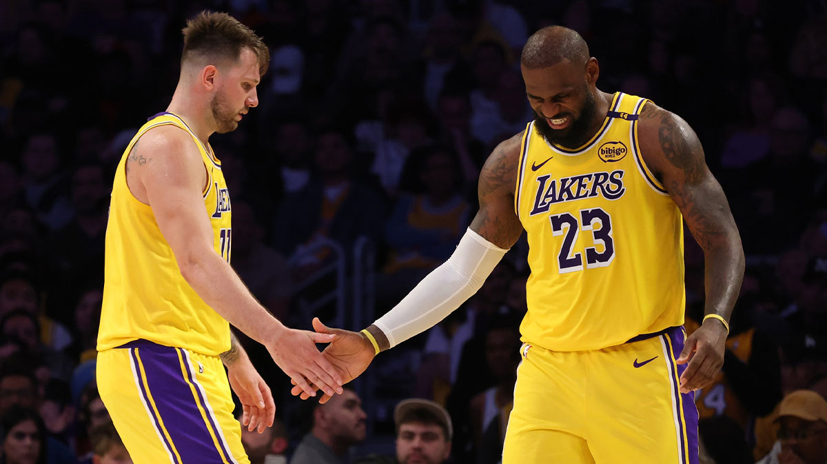 Los Angeles Lakers guard Luka Doncic (77) and forward LeBron James (23) celebrate after a play during the fourth quarter against the Minnesota Timberwolves at Crypto.com Arena.