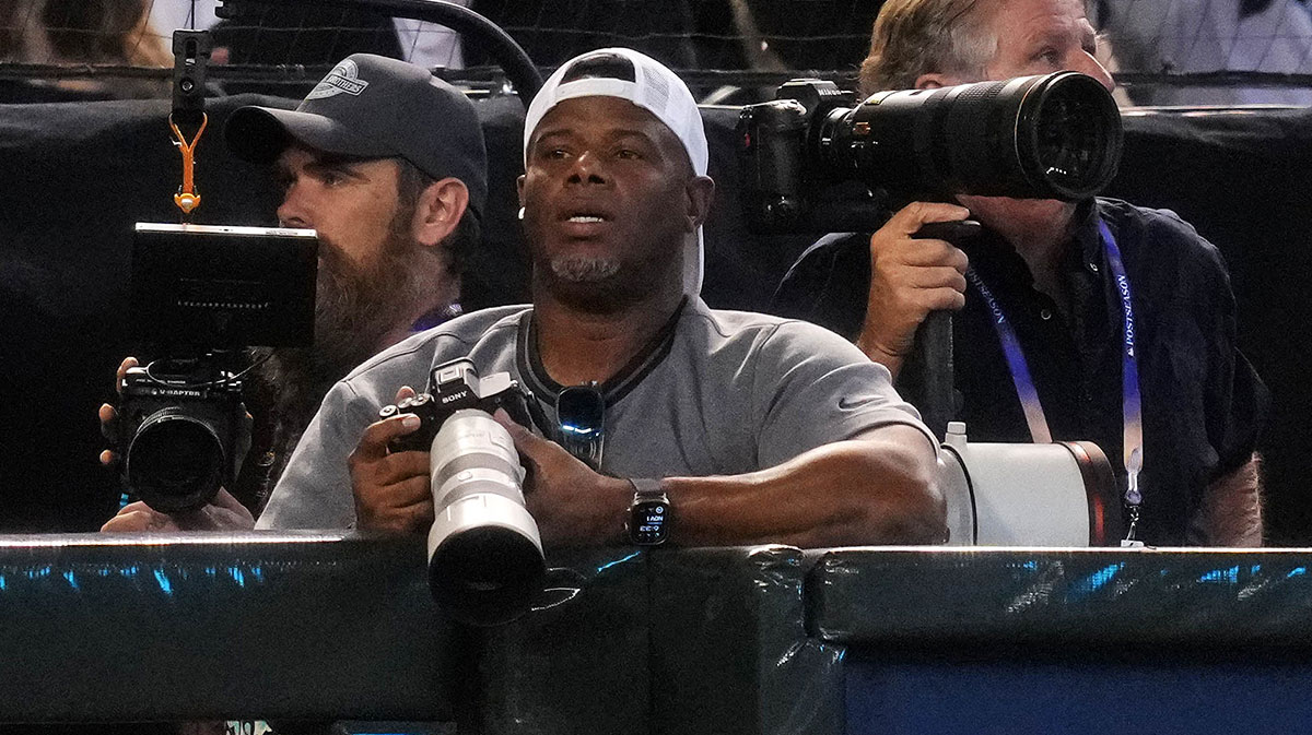 Baseball Hall of Famer Ken Griffey Jr. photographs Game 5 of the 2023 World Series between the Diamondbacks and Rangers at Chase Field in Phoenix on Nov. 1, 2023.