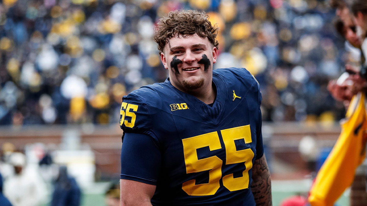 Blue Team defensive lineman Mason Graham (55) walks up the tunnel for halftime during the spring game at Michigan Stadium