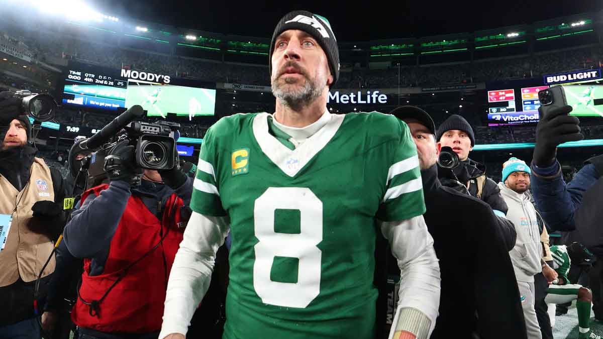 New York Jets quarterback Aaron Rodgers (8) walks on the field after the Jets win over the Miami Dolphins at MetLife Stadium.