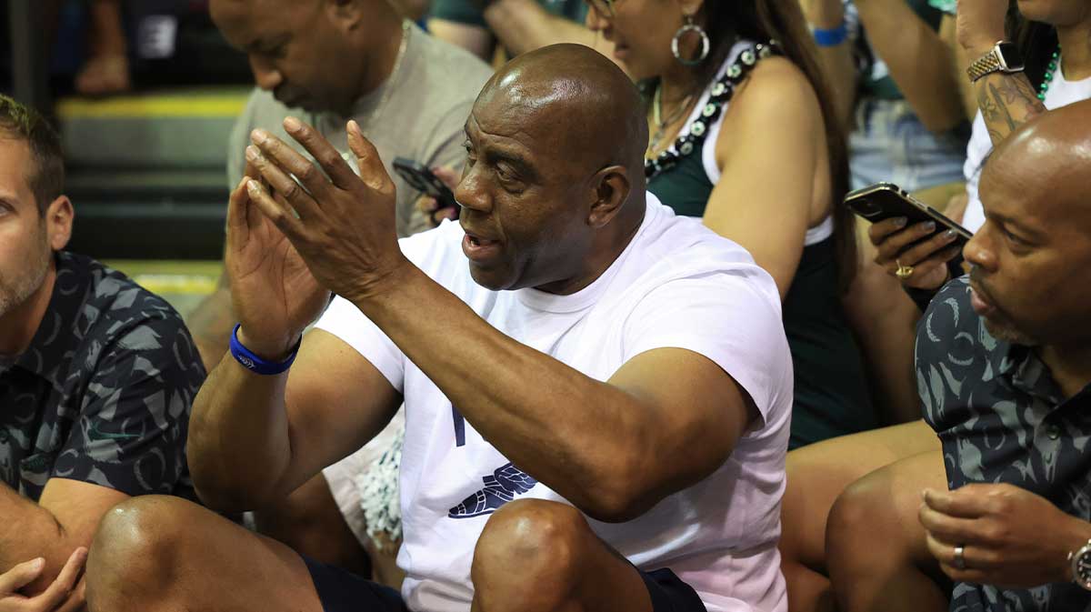 Nov 25, 2024; Lahaina, Hawaii, USA; Former professional basketball player and Michigan State alumni, Earving “Magic” Johnson, center, watches the Colorado Buffaloes take on the Michigan State Spartans in the first half of an NCAA college basketball game at Lahaina Civic Center. Mandatory Credit: Marco Garcia-Imagn Images