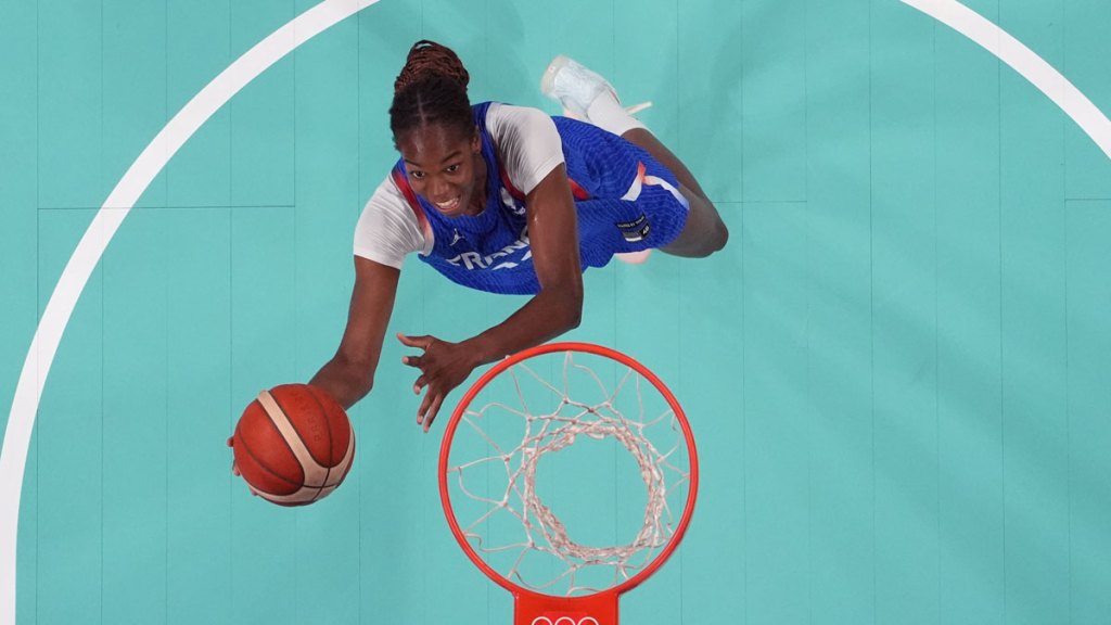 France center Dominique Malonga (14) goes to the basket against Canada during the Paris 2024 Olympic Summer Games at Stade Pierre-Mauroy.