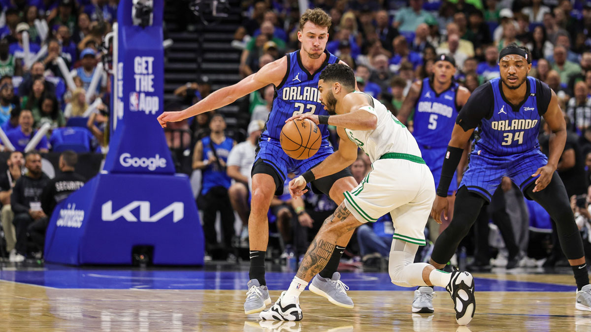 Apr 25, 2025; Orlando, Florida, USA; Orlando Magic forward Franz Wagner (22) defends Boston Celtics forward Jayson Tatum (0) during the first quarter of game three of first round for the 2025 NBA Playoffs at Kia Center.