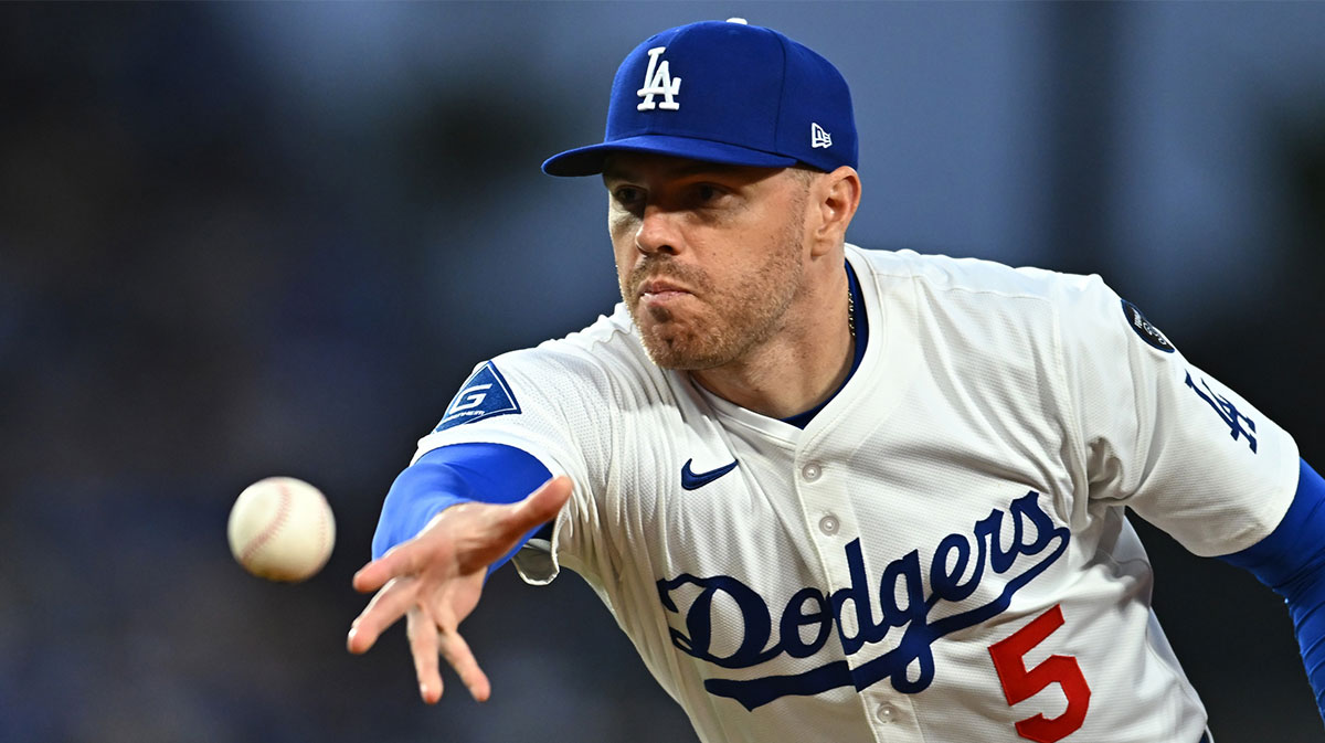Los Angeles Dodgers first baseman Freddie Freeman (5) tosses to first for an out during the 3rd inning against the Detroit Tigers at Dodger Stadium. Mandatory Credit: Jonathan Hui-Imagn Images