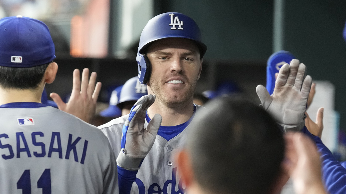 Los Angeles Dodgers first baseman Freddie Freeman (5) celebrates his two-run home run with teammates in the dugout during the fourth inning against the Texas Rangers at Globe Life Field