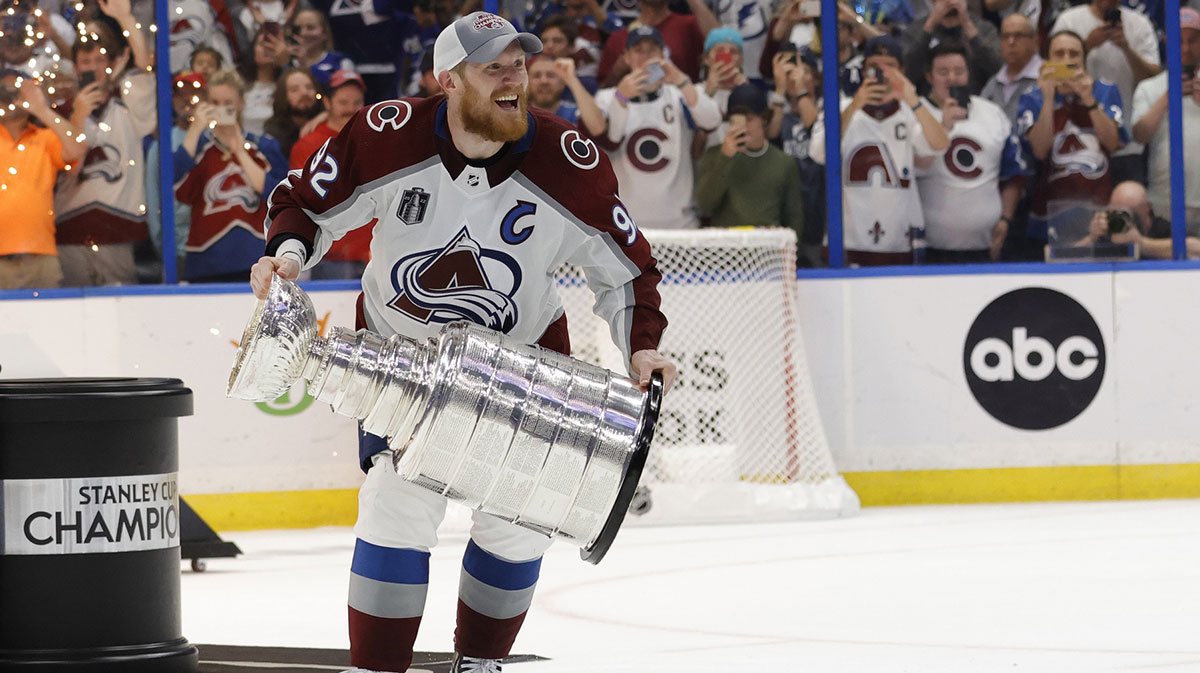 Colorado Avalanche left wing Gabriel Landeskog (92) celebrates with the Stanley Cup after the game against the Tampa Bay Lightning in game six of the 2022 Stanley Cup Final at Amalie Arena.