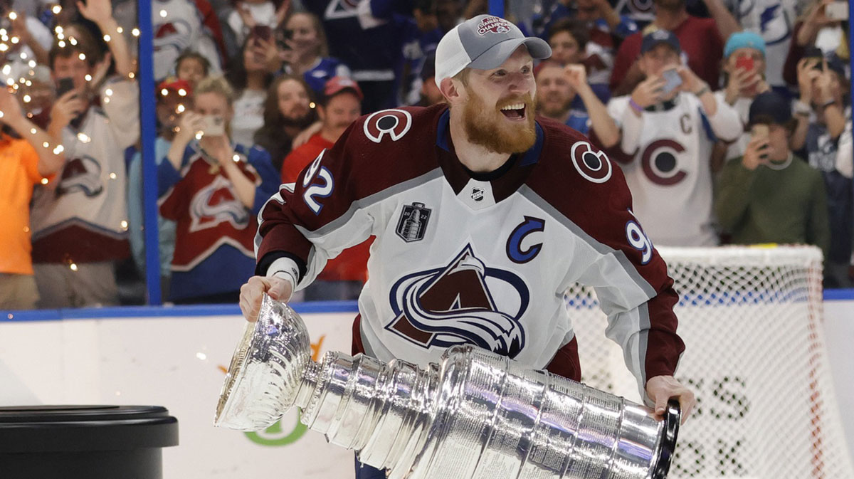 Colorado Avalanche left wing Gabriel Landeskog (92) celebrates with the Stanley Cup after the game against the Tampa Bay Lightning in game six of the 2022 Stanley Cup Final at Amalie Arena.