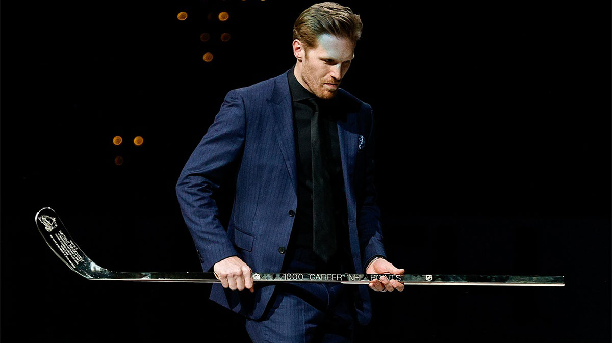 Colorado Avalanche captain Gabriel Landeskog carries a commemorative stick for center Nathan MacKinnon (not pictured) during an on ice presentation celebrating 1,000 career points before the game against the Dallas Stars at Ball Arena.