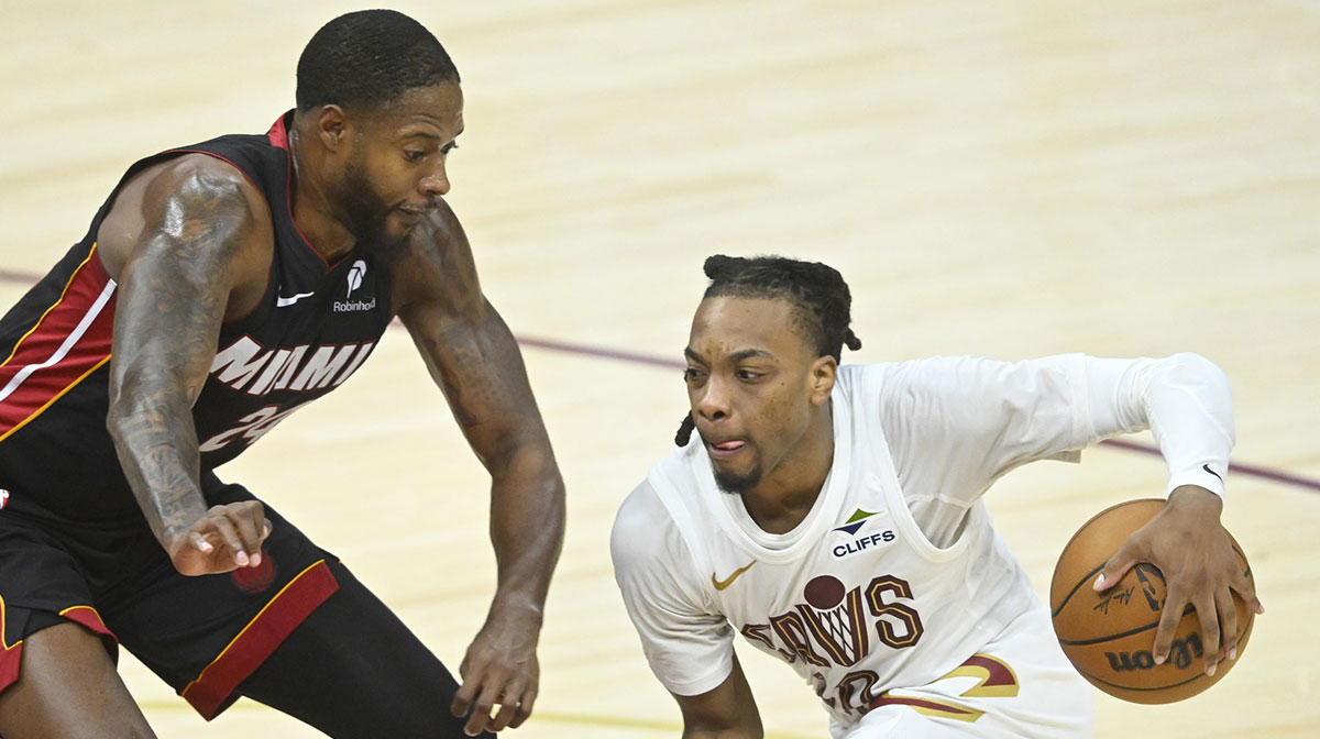 Miami Heat forward Haywood Highsmith (24) defends Cleveland Cavaliers guard Darius Garland (10) in the fourth quarter of game two of the first round of the 2025 NBA Playoffs at Rocket Arena.