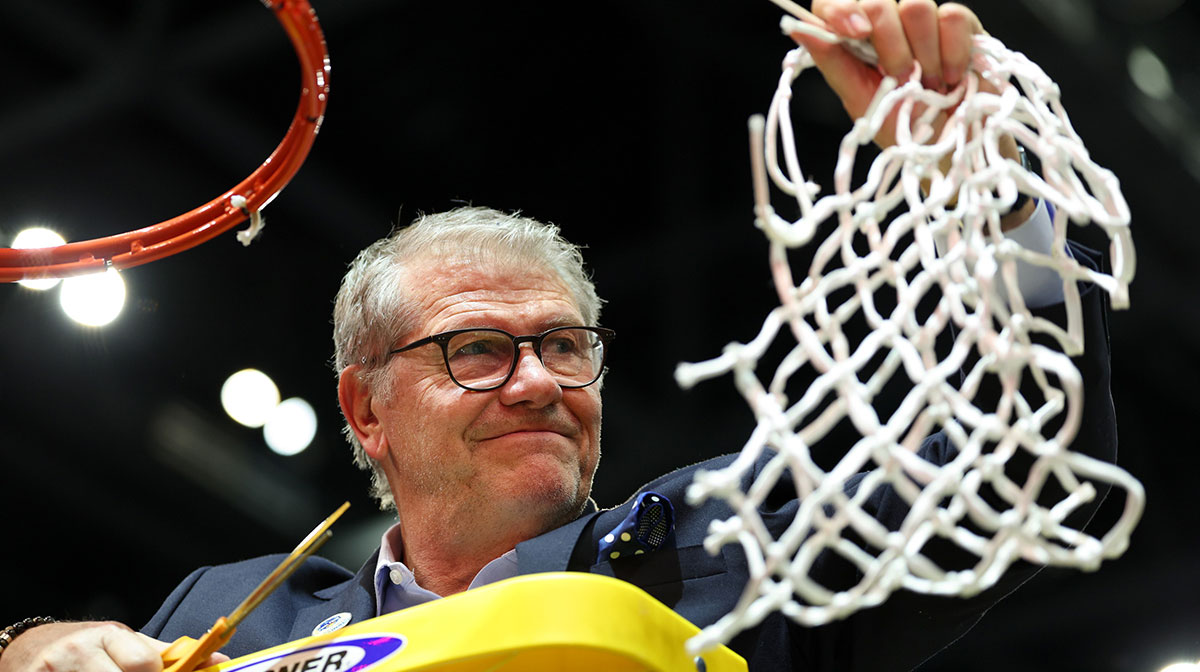 Connecticut Huskies head coach Geno Auriemma cuts off the net after the national championship of the women's 2025 NCAA tournament against the South Carolina Gamecocks at Amalie Arena