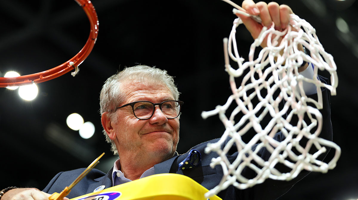 Connecticut Huskies head coach Geno Auriemma cuts off the net after the national championship of the women's 2025 NCAA tournament against the South Carolina Gamecocks at Amalie Arena.