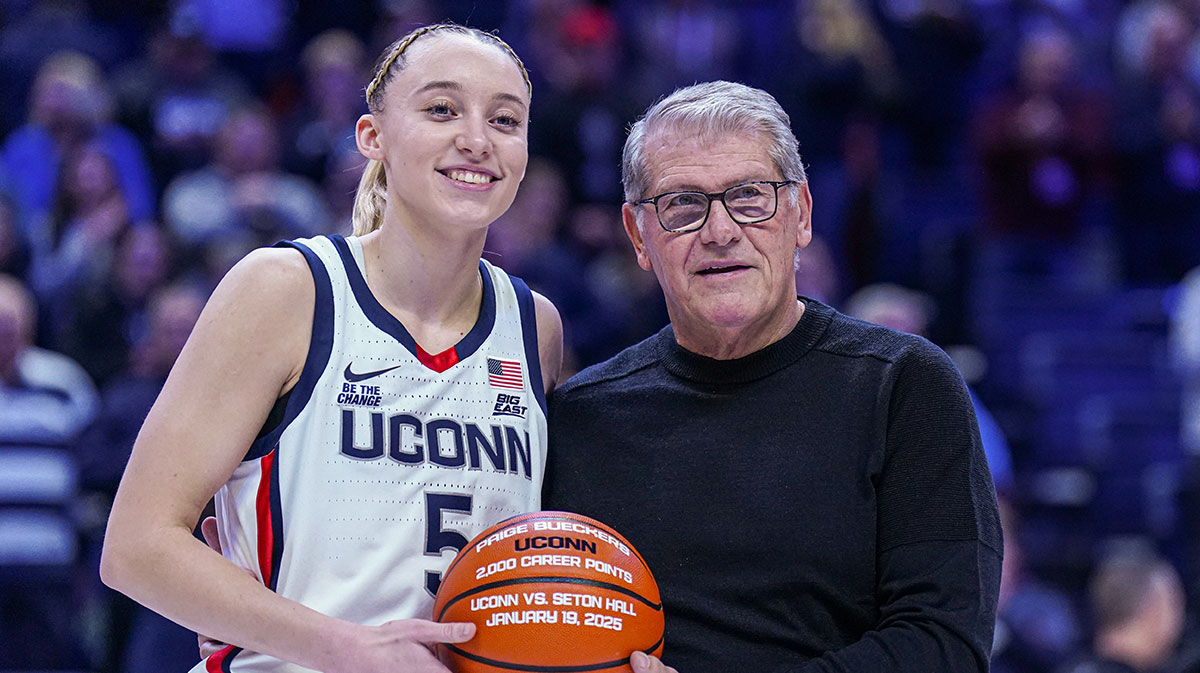UConn Huskies guard Paige Bueckers (5) is recognized with head coach Geno Auriemma for her 2000 career points before the start of the game against the Villanova Wildcats at Harry A. Gampel Pavilion.