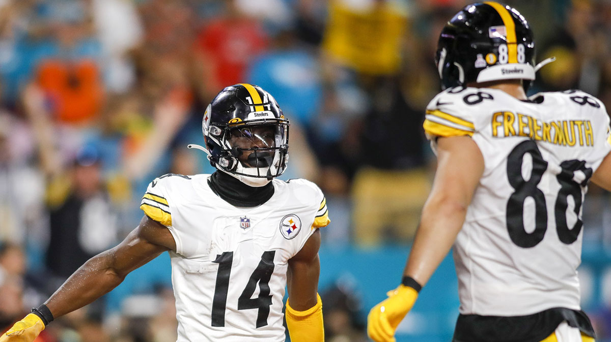 Pittsburgh Steelers wide receiver George Pickens (14) celebrates with tight end Pat Freiermuth (88) after scoring a touchdown during the second quarter against the Miami Dolphins at Hard Rock Stadium.