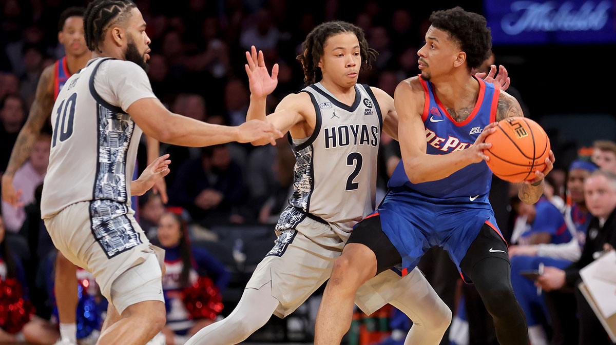 DePaul Blue Demons guard CJ Gunn (11) controls the ball against Georgetown Hoyas guards Malik Mack (2) and Jayden Epps (10) during the second half at Madison Square Garden. Mandatory Credit: Brad Penner-Imagn Images