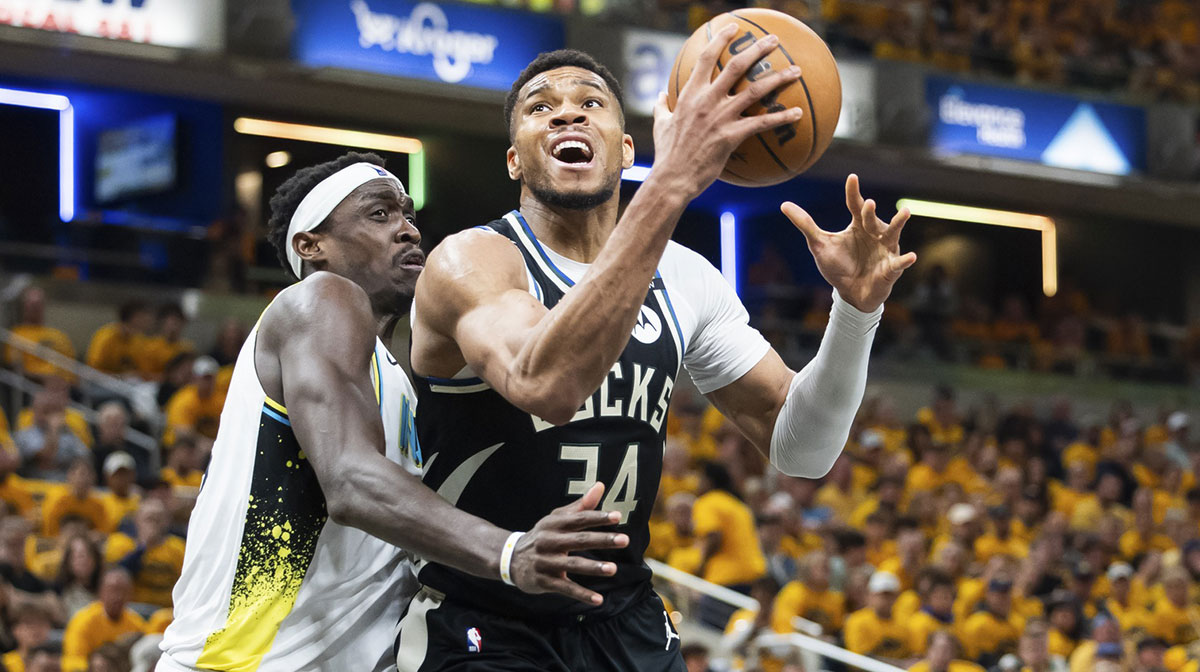Milwaukee Bucks forward Giannis Antetokounmpo (34) shoots the ball while Indiana Pacers forward Pascal Siakam (43) defends in the first half at Gainbridge Fieldhouse.
