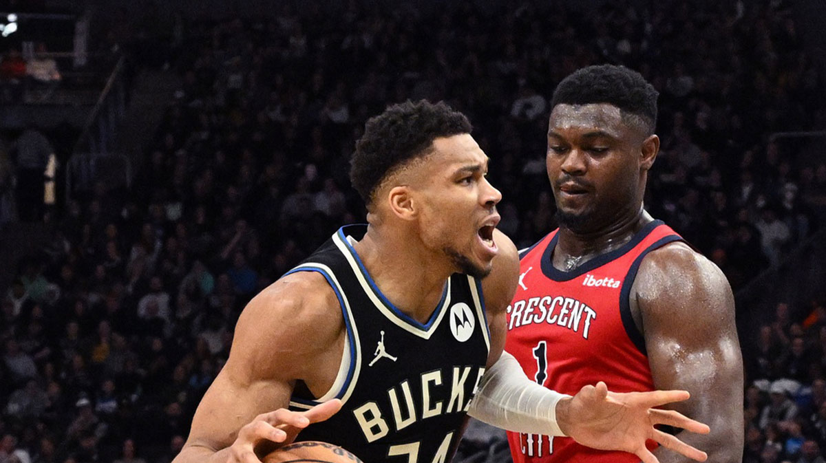 Milwaukee Bucks forward Giannis Antetokounmpo (34) drives against New Orleans Pelicans forward Zion Williamson (1) in the second half at Fiserv Forum.