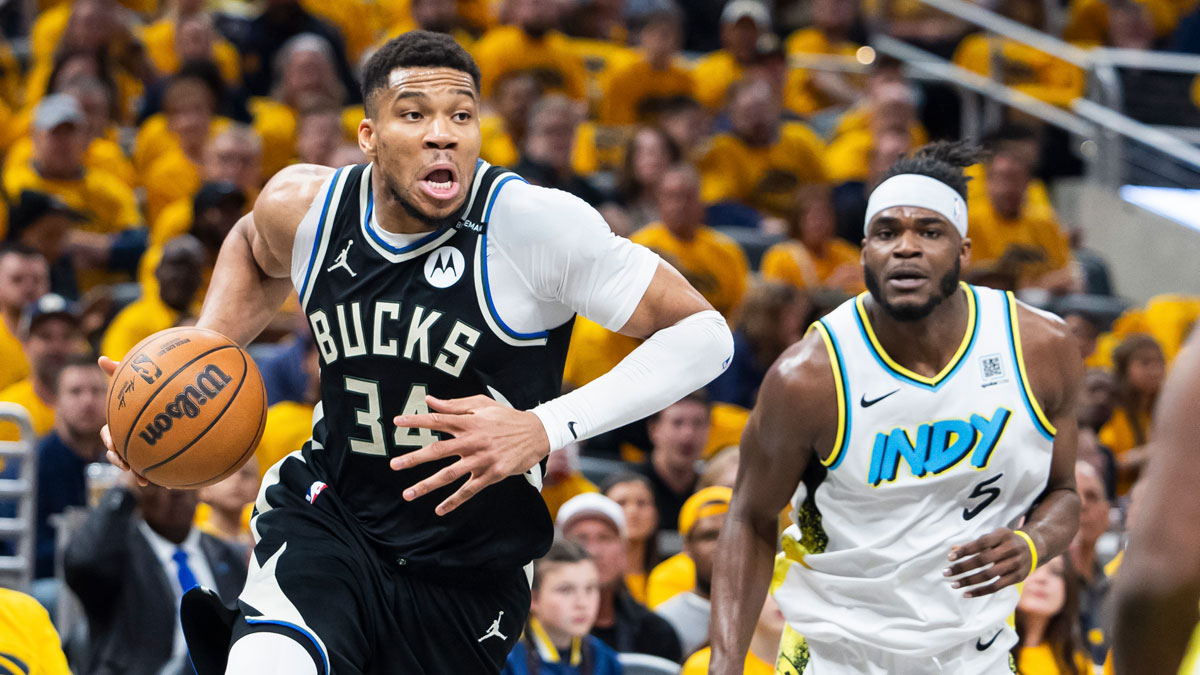 Milwaukee Bucks forward Giannis Antetokounmpo (34) dribbles the ball while Indiana Pacers forward Jarace Walker (5) defends in the first half at Gainbridge Fieldhouse