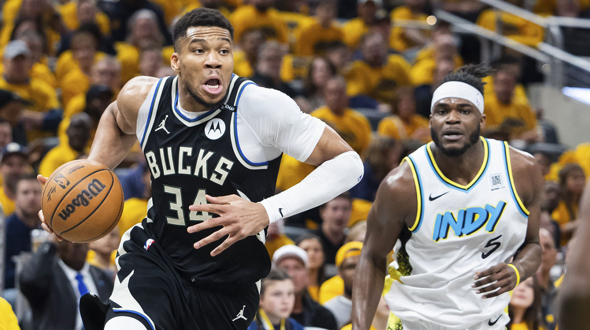 Milwaukee Bucks forward Giannis Antetokounmpo (34) dribbles the ball while Indiana Pacers forward Jarace Walker (5) defends in the first half at Gainbridge Fieldhouse.
