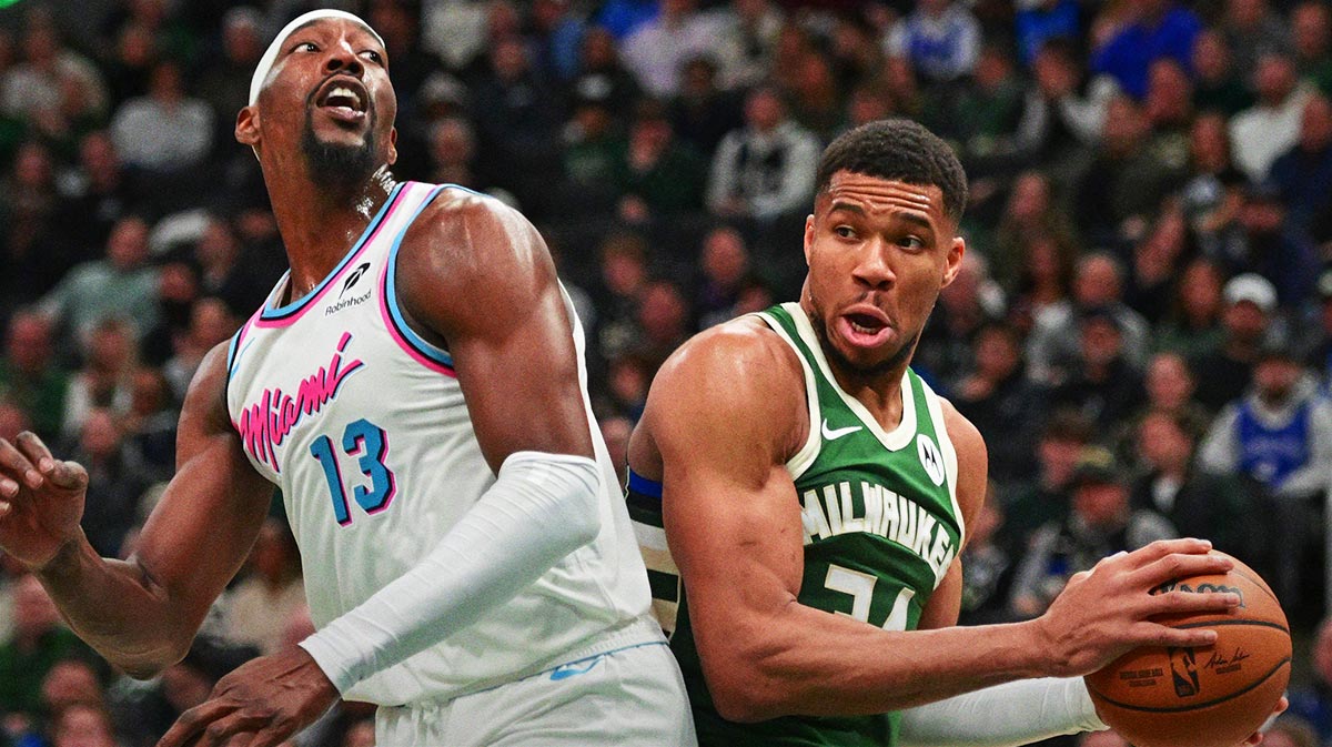 Milwaukee Bucks forward Giannis Antetokounmpo (34) looks for a shot against Miami Heat center Bam Adebayo (13) in the second quarter at Fiserv Forum.