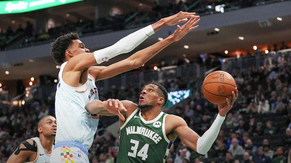 Milwaukee Bucks forward Giannis Antetokounmpo (34) looks to shoot under pressure from San Antonio Spurs forward Victor Wembanyama (1) during the fourth quarter at Fiserv Forum.