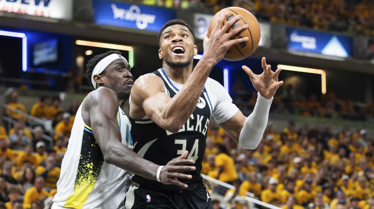 Milwaukee Bucks forward Giannis Antetokounmpo (34) shoots the ball while Indiana Pacers forward Pascal Siakam (43) defends in the first half at Gainbridge Fieldhouse.